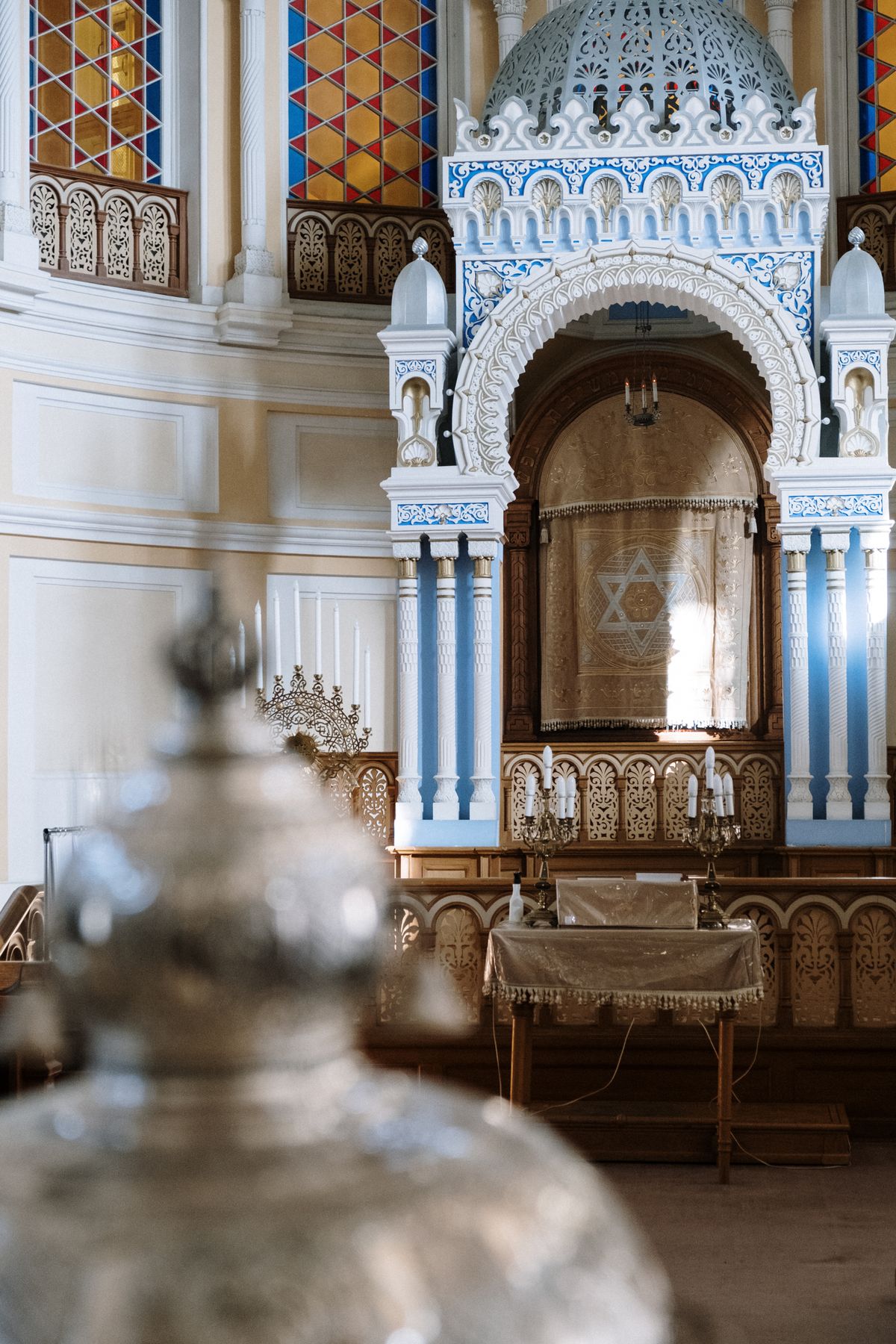 An ornate Torah ark inside a synagogue, symbolizing Jewish tradition and faith